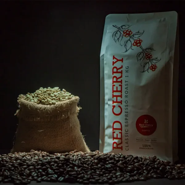 Commercial PLB Green Beans from Red Cherry Coffee in eco-friendly jute packaging beside a roasted beans pack.